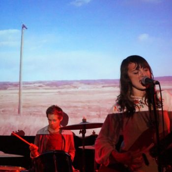 Katie Ellen introduces themselves to a psyched PhilaMOCA audience for <i>Cowgirl Blues</i> record release show