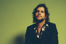 A guy sitting in chair