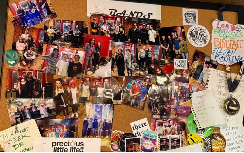 The bulletin board at Philly Style Pizza & Grill, which doubles as a DIY venue for local bands.